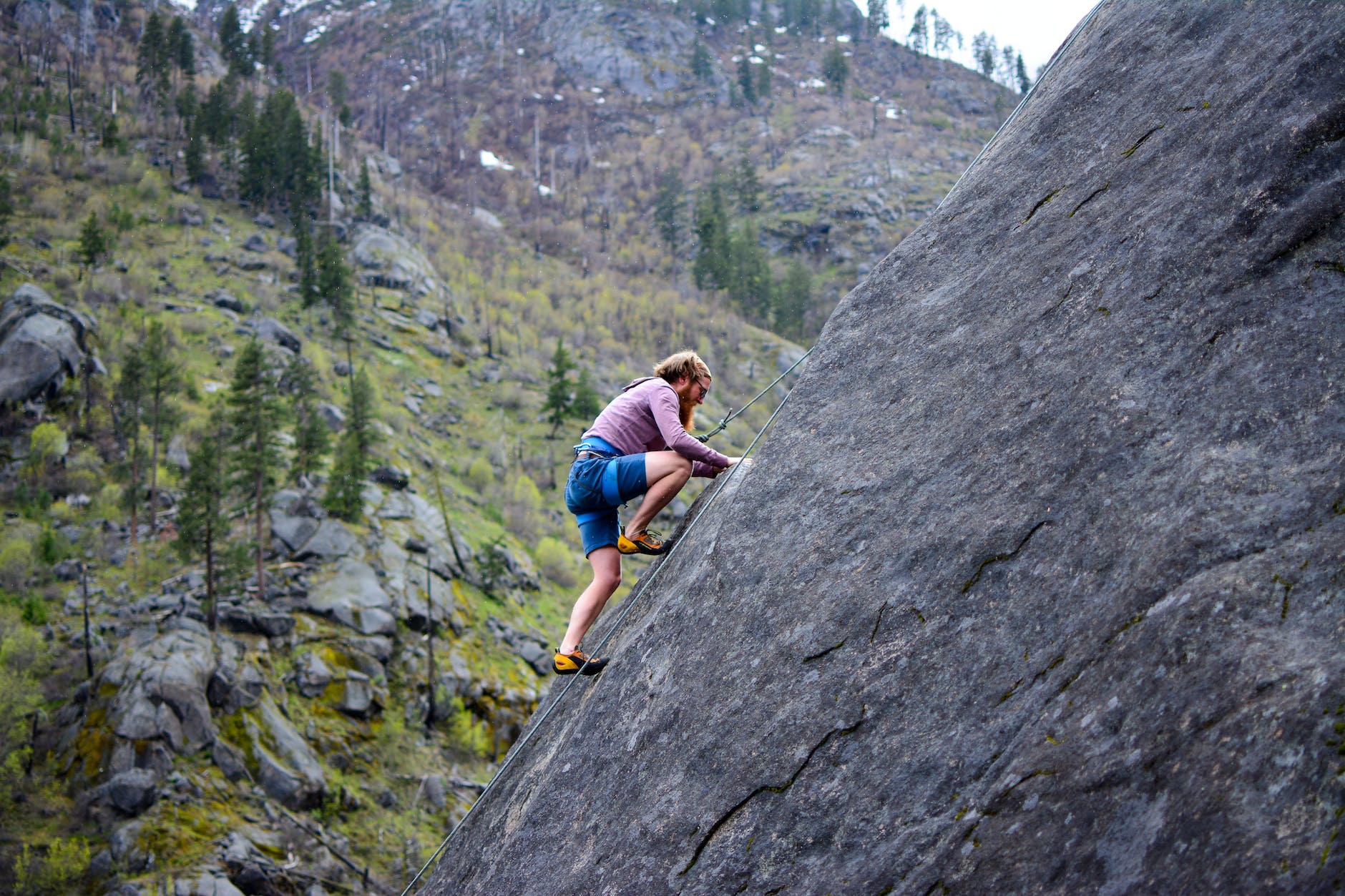 motivation spectrum - man climbing on rock mountain